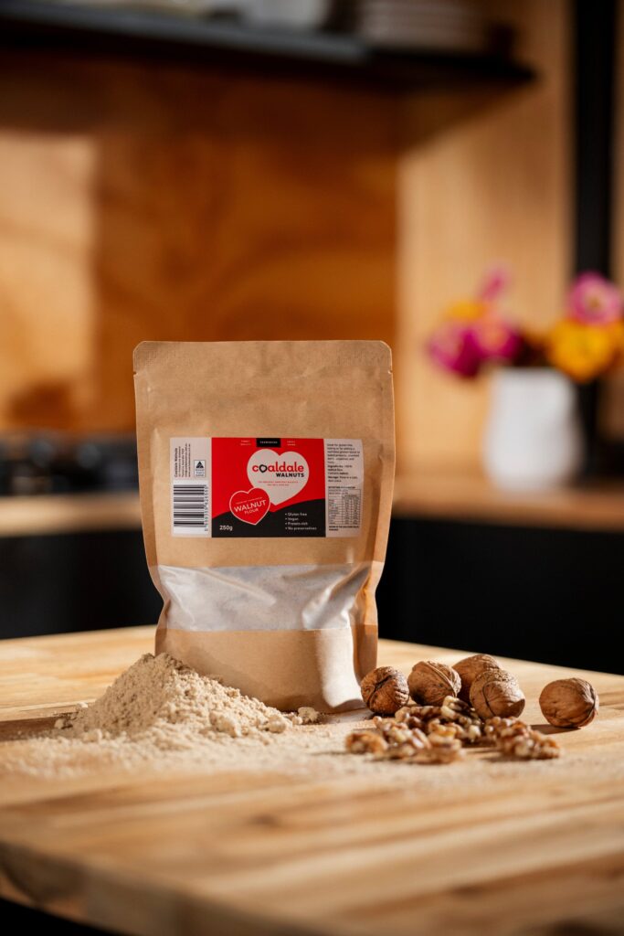 walnut flour sitting next to walnuts