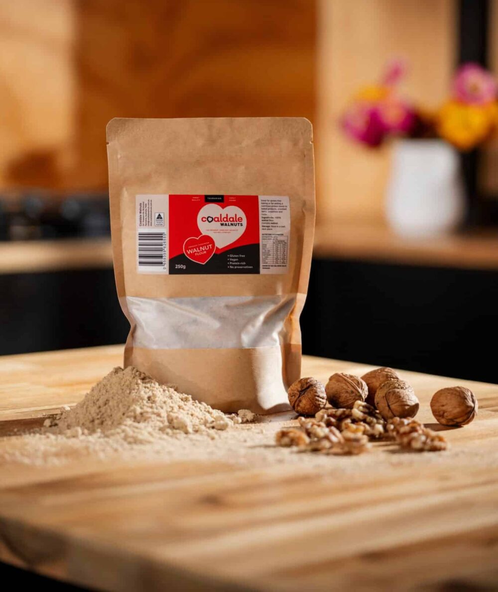 walnut flour sitting next to walnuts