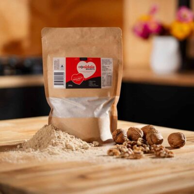 walnut flour sitting next to walnuts