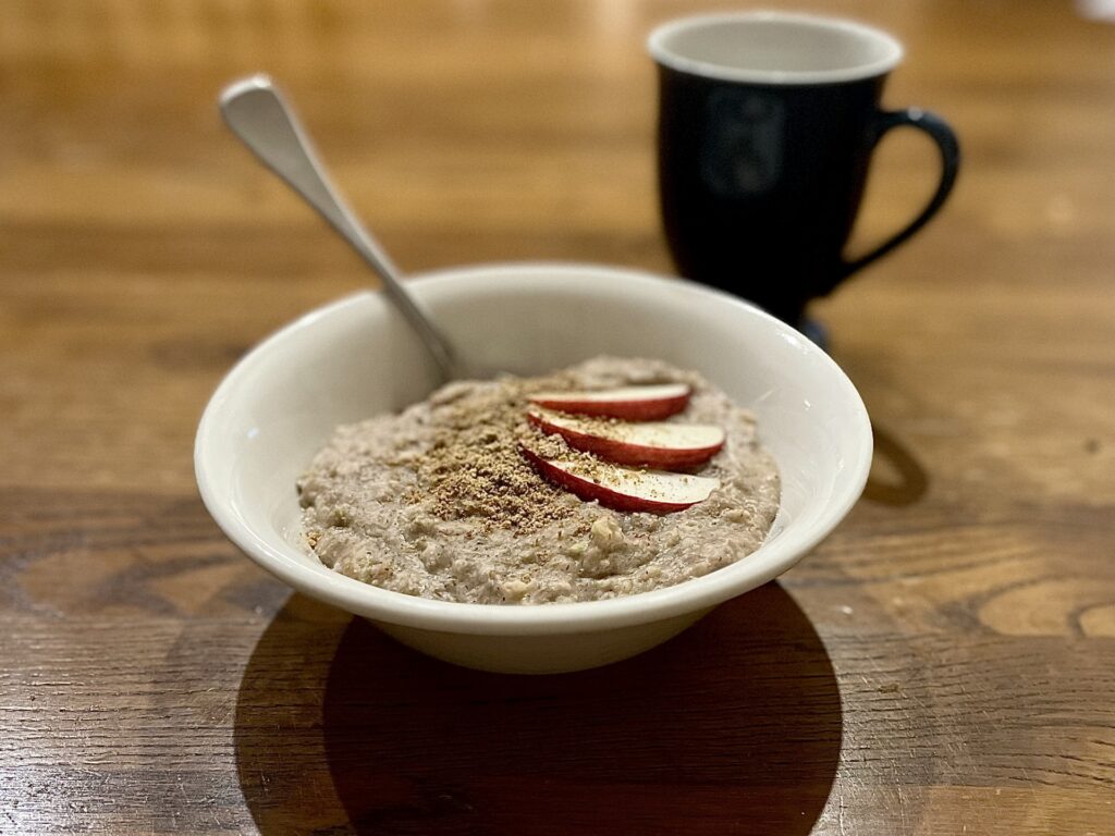 Apple and walnut porridge sitting in a bowl